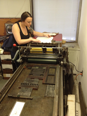 image: A student prints using our Vandercook 219 oldstyle!