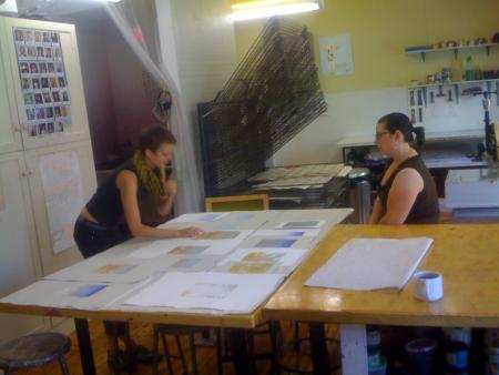 image: Silkscreen and Intaglio room.  Keymember working with an Artist to curate an edition they worked on together.  
